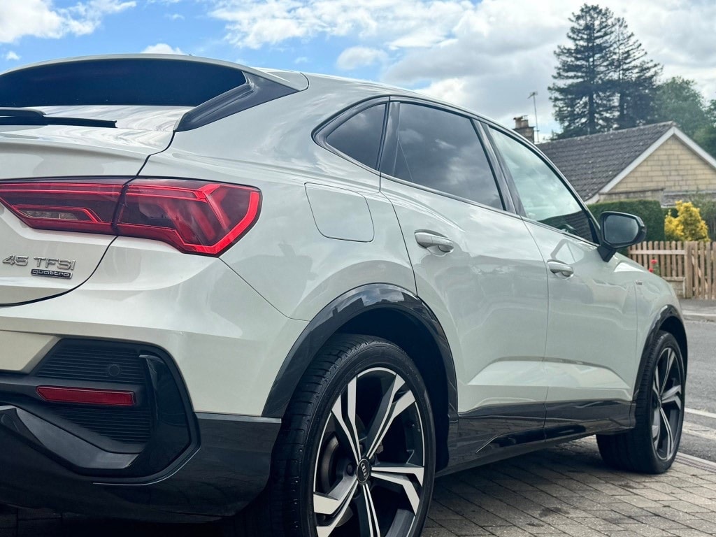 Detailed white Audi Q3 Sportback rear quarter with deep gloss