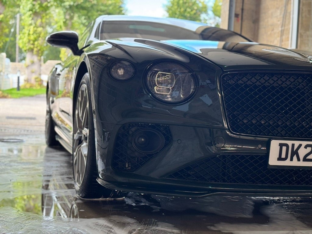 Gloss black Bentley Continental GT front end after detailing