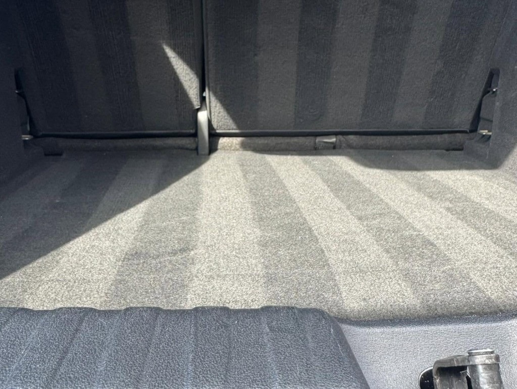 Vacuumed car carpet with crisp lines after an interior detail