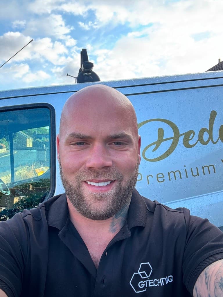 Matt, owner and detailer at Dedicated 2 Detail, in front of his branded van
